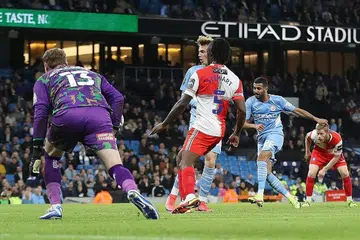 TUNJUK HEBAT: Riyad Mahrez (dua dari kanan) menjaringkan dua gol untuk membantu City bangkit selepas ketinggalan semasa kemenangan besar pasukannya 6-1 ke atas Wycombe. - Foto REUTERS