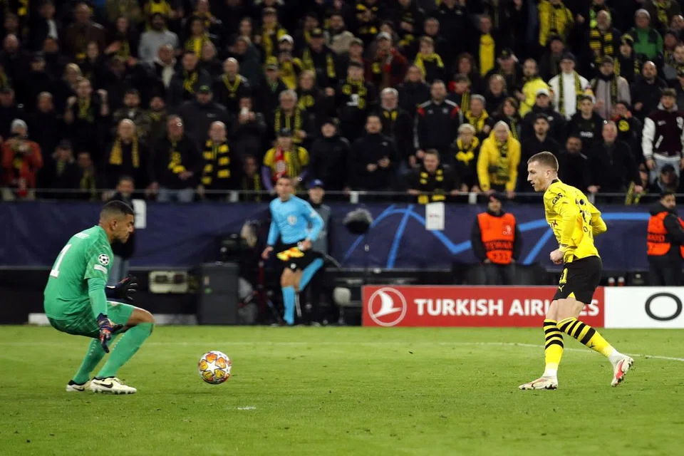 Pemain sayap, Marco Reus, menjaringkan gol kedua Dortmund, yang mengalahkan PSV Eindhoven 2-0 untuk ke suku akhir Liga Juara-Juara kali pertama dalam tiga tahun.