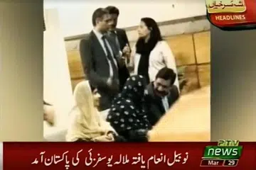 DISAMBUT: Malala Yousafzai duduk bersama keluarganya di lounge VIP lapangan terbang Islamabad, dalam gambar yang diambil daripada video yang disiarkan semalam. - Foto REUTERS