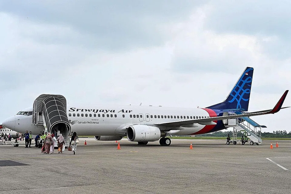 PENERBANGAN TIDAK LAGI DIGANTUNG: Dengan terjalin kembali kerjasama dengan Garuda, 18 pesawat Sriwijaya Air yang dianggap tidak layak terbang akan dapat kembali beroperasi. - Foto AFP
