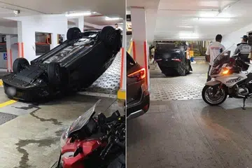 Sebuah kereta hitam dipercayai terbabas lalu terbalik di sebuah tempat letak kereta bertingkat di Woodlands pada petang 2 Jun.