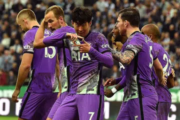 GOL KETIGA: Penyerang Tottenham asal Korea (tengah) meraikan gol ketiga pasukannya semasa kemenangan 3-2 ke atas Newcastle di St James' Park kelmarin. - Foto AFP
