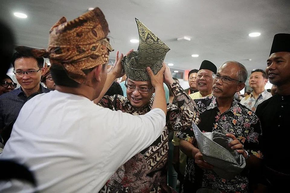 BERSAMA SEJAK 2011 Di GRC TAMPINES: Encik Masagos bersama DPM Heng dalam acara Bulan Bahasa di Tampines West CC pada 21 September 2019. - Foto fail
