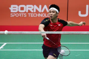 Pemain Singapura, Loh Kean Yew, beraksi semasa perlawanan suku akhir perseorangan lelaki badminton Sukan Asia Aichi-Nagoya 2026 menentang pemain nombor satu dunia dari Indonesia, Jonatan Christie, pada 27 September.