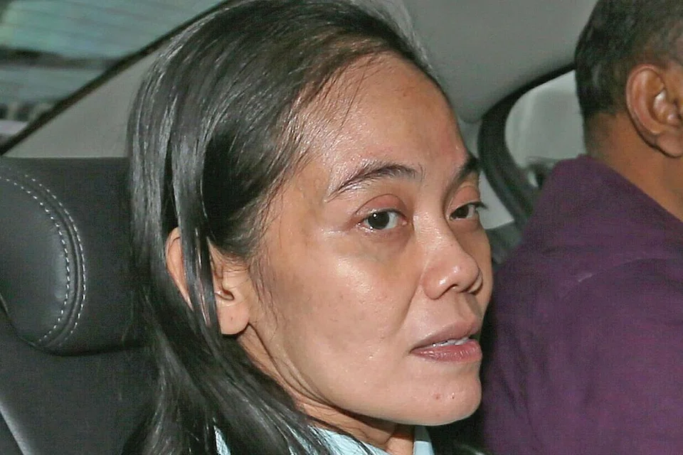 HUKUMAN PENJARA: Rahmeswati Semass, 48 tahun, dikenakan hukuman penjara lapan bulan selepas dia mengaku bersalah atas tiga pertuduhan berurusan dengan hasil kegiatan jenayah. - Foto BH oleh WONG KWAI CHOW