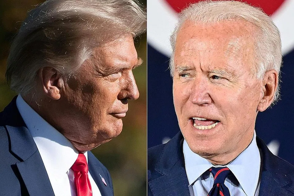 SALING DAKWA: Encik Biden (kanan) menuduh Encik Trump menyembunyikan bahaya sebenar Covid-19. Namun Encik Trump mempertahankan cara beliau tangani wabak virus itu. - Foto AFP 