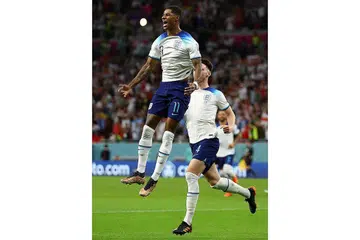CEMERLANG: Marcus Rashford meraikan gol pertamanya bagi England semasa menundukkan Wales kelmarin. - Foto REUTERS