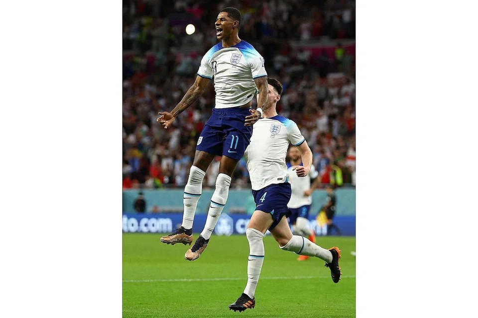 CEMERLANG: Marcus Rashford meraikan gol pertamanya bagi England semasa menundukkan Wales kelmarin. - Foto REUTERS