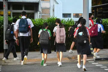 BANTUAN DISEDIAKAN: Subsidi yang diberikan adalah di bawah Skim Bantuan Kewangan MOE yang membayar sebahagian kos perbelanjaan di sekolah. - Foto fail