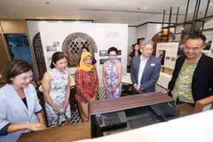 Mantan Presiden, Puan Halimah Yacob (tiga dari kiri), yang melawat galeri warisan baru untuk memperingati ulang tahun ke-150 YWCA pada 28 Oktober berkata, walau wanita kian ramai dalam tenaga kerja dan maju dalam pendidikan dan kerjaya, tuntutan masyarakat terhadap tugas wanita sebagai penjaga, masih belum banyak berubah.