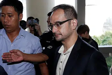 MENGAKU TIDAK BERSALAH: Riza Shahriz (atas) mengaku tidak bersalah terhadap semua pertuduhan. - Foto REUTERS
