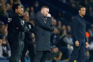 DIHIMPIT ISU KEWANGAN: Wayne Rooney semasa perlawanan liga Championship antara Derby County dan West Bromwich Albion pada 14 September. - Foto fail