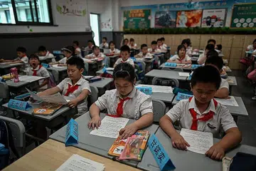 SEKOLAH DIBUKA: Musim persekolahan baru dibuka 1 September lalu setelah ditutup hampir tujuh bulan. - Foto AFP 