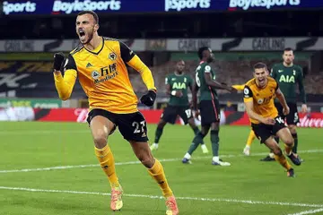 LEBIH BERSEMANGAT: Gol Romain Saiss empat minit sebelum wisel penamat menghadiahkan Wolves satu mata dalam perlawanan seri 1-1 menentang Tottenham di Molineux kelmarin. - Foto AFP