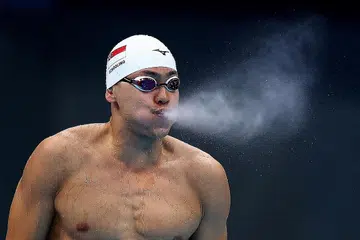 TUMPU PADA KUPU-KUPU 100 METER: Schooling mencatat masa 49.84 saat dalam saringan gaya bebas 100 meter lelaki di Pusat Akuatik Tokyo semalam, dan tidak berjaya ke separuh akhir. - Foto REUTERS