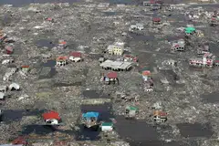 Kampung yang tenggelam terletak dekat pantai di Aceh musnah kesemuanya selepas gempa dan tsunami yang menyusuli.