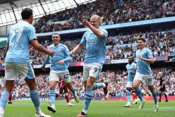 TOKOH JUARA: Erling Haaland (jersi nombor 9) raikan jaringannya bersama pasukannya. Pasukan bimbingan Pep Guardiola pamer daya tahan untuk menang perlawanan walaupun kurang satu pemain selepas pemain tengah, Rodri, dilayangkan kad merah.