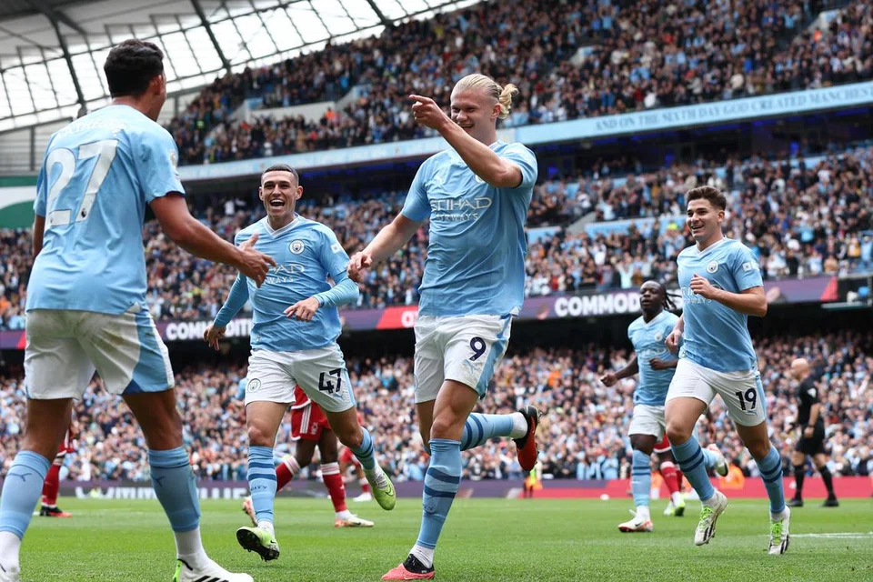 TOKOH JUARA: Erling Haaland (jersi nombor 9) raikan jaringannya bersama pasukannya. Pasukan bimbingan Pep Guardiola pamer daya tahan untuk menang perlawanan walaupun kurang satu pemain selepas pemain tengah, Rodri, dilayangkan kad merah.