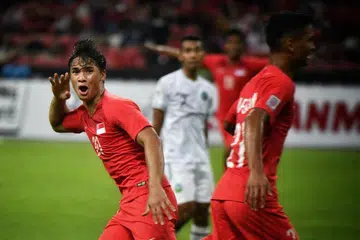 Ikhsan Fandi meraikan gol kedua yang dijaringkannya, satu tendangan akrobatik yang memperdaya penjaga gawang Timor-Leste