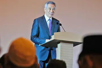 MENGIKTIRAF SUMBANGAN MUIS: Encik Lee berkata kesanggupan Muis menghadapi dan bertindak terhadap isu-isu yang sukar menjadikan ia sebuah institusi dihormati di Singapura. - Foto BH oleh MARK CHEONG