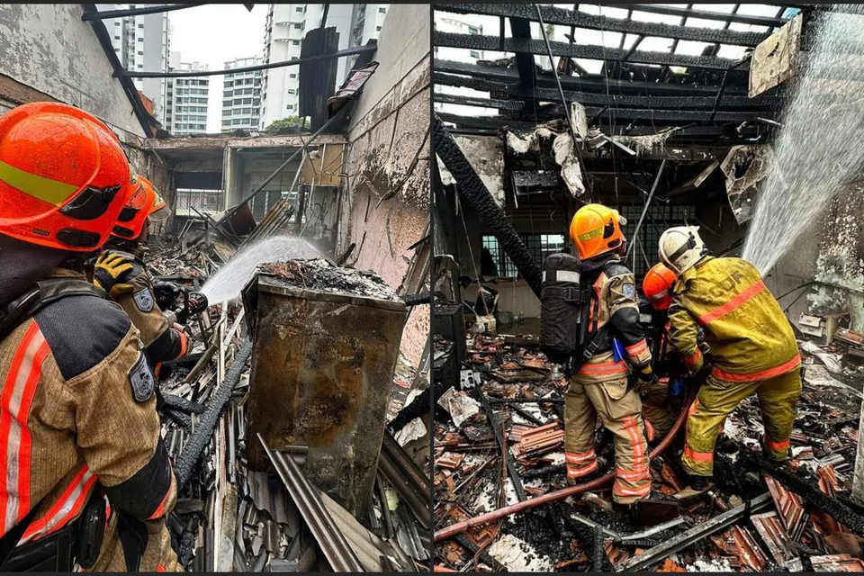 TERPAKSA DIPINDAHKAN: Kira-kira 30 penghuni terpaksa dipindahkan selepas kebakaran berlaku di sebuah unit rumah kedai di 61 Geylang Lorong 27 kira-kira 7.30 pagi Isnin.