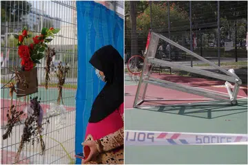 Cik Rahimah Lee Abdullah di gelanggang bola keranjang di mana anaknya Mohd Ridwan meninggal dunia setelah struktur papan bola keranjang (kanan) jatuh menimpanya pada Julai lau. - Foto BH oleh MARK CHEONG, TIMOTHY DAVID