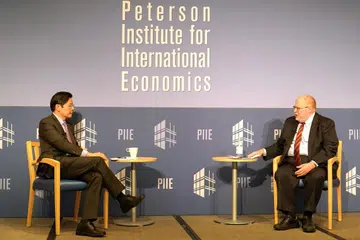 SUKAR BENDUNG CHINA: Akan semakin sukar untuk Amerika membendung China, kata Encik Lawrence Wong dalam dialog anjuran Institut Peterson bagi Ekonomi Antarabangsa di Washington DC yang dipengerusikan presiden institut itu, Dr Adam Posen. - Foto KEMENTERIAN KEWANGAN