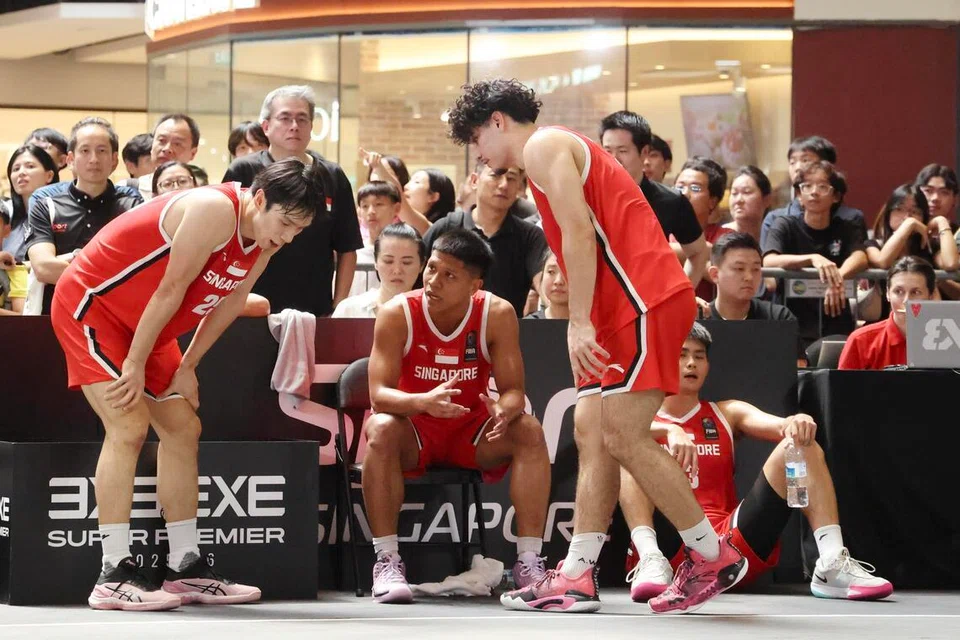 Walaupun dahulu jarang dapat masa bermain, pemain bola keranjang 3x3 Singapura, Nur Aufa Emil Putra (dua dari kiri, duduk), kini bangkit sebagai kapten pasukan nasional. Rakan sepasukannya meletakkan kepercayaan mereka kepadanya untuk bantu membimbing mereka. 