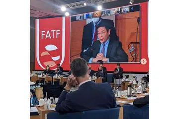HADIRI MESYUARAT: Encik Lawrence Wong (dalam paparan skrin) menghadiri Mesyuarat Menteri FATF, sebuah badan pemerhati pengubahan wang haram dan pembiayaan pengganas sejagat, di Washington pada Khamis lalu. - Foto KEMENTERIAN KEWANGAN