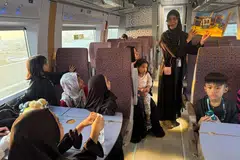 Kanak-kanak terlibat dalam kegiatan sewaktu dalam kereta api laju Haramain.