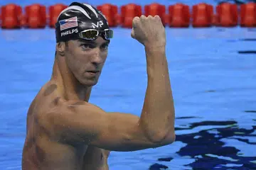 LEGENDA TUNJUK KUAT: Jaguh renang Amerika, Michael Phelps, terus meledakkan kehebatannya dengan memenangi dua lagi pingat emas di temasya Rio semalam. - Foto AFP