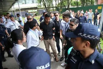 DIDAKWA: Sheikh Md Razan, 29 tahun, ditangkap di Muscat Street di Kampong Glam, di kawasan tempat tinggalnya.