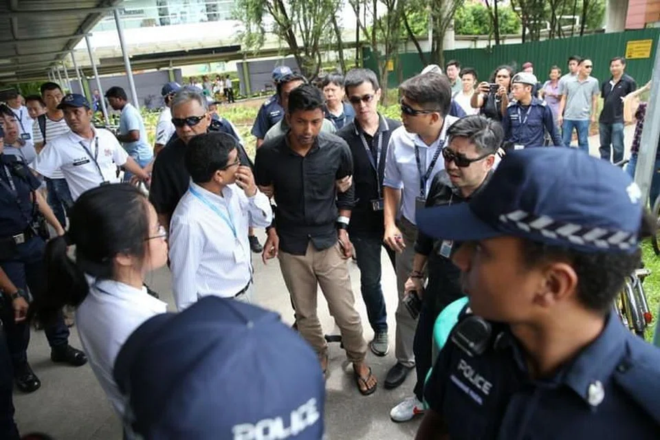 DIDAKWA: Sheikh Md Razan, 29 tahun, ditangkap di Muscat Street di Kampong Glam, di kawasan tempat tinggalnya.