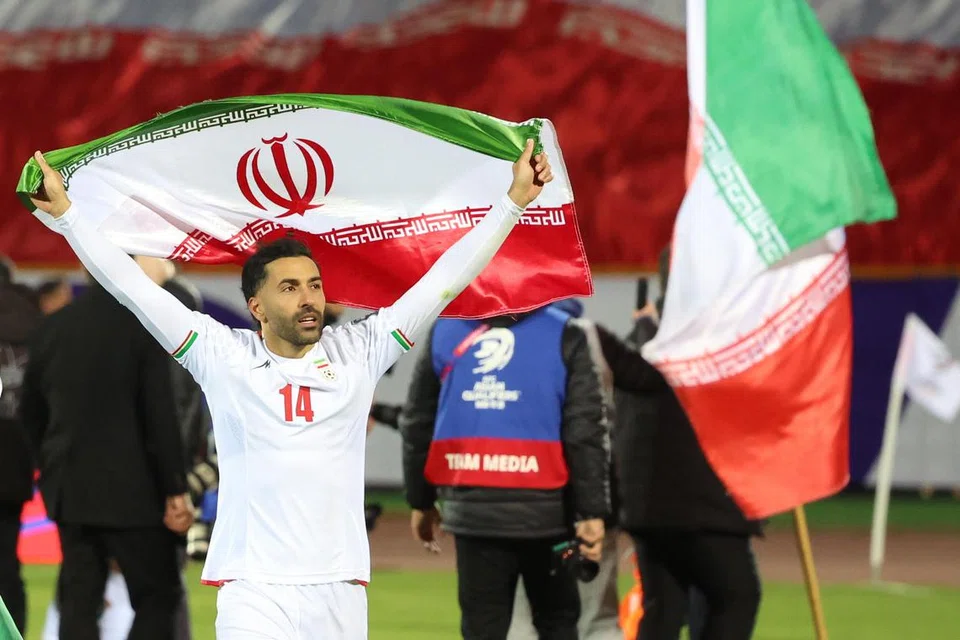 Pemain tengah Iran, Saman Ghoddos, meraikan keputusan seri 2-2 menentang Uzbekistan, yang bermakna mereka layak ke pusingan akhir Piala Dunia, pada 25 Mac.