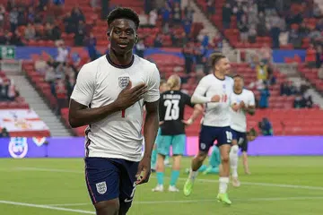 GOL KEMENANGAN: Pemain England Bukayo Saka meraikan jaringan pada aksi persahabatan menentang Austria di Stadium Riverside, Middlesbrough. - Foto-foto AFP 
