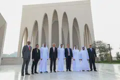LAMBANG PERPADUAN: Encik Lee (empat dari kiri) bergambar di hadapan masjid yang merupakan sebahagian daripada kompleks antara agama Abrahamic Family House di Abu Dhabi yang melambangkan nilai perpaduan. (Dari kiri) Dr Janil Puthucheary, Dr Maliki Osman, dan Dr Tan See Leng (empat dari kanan).