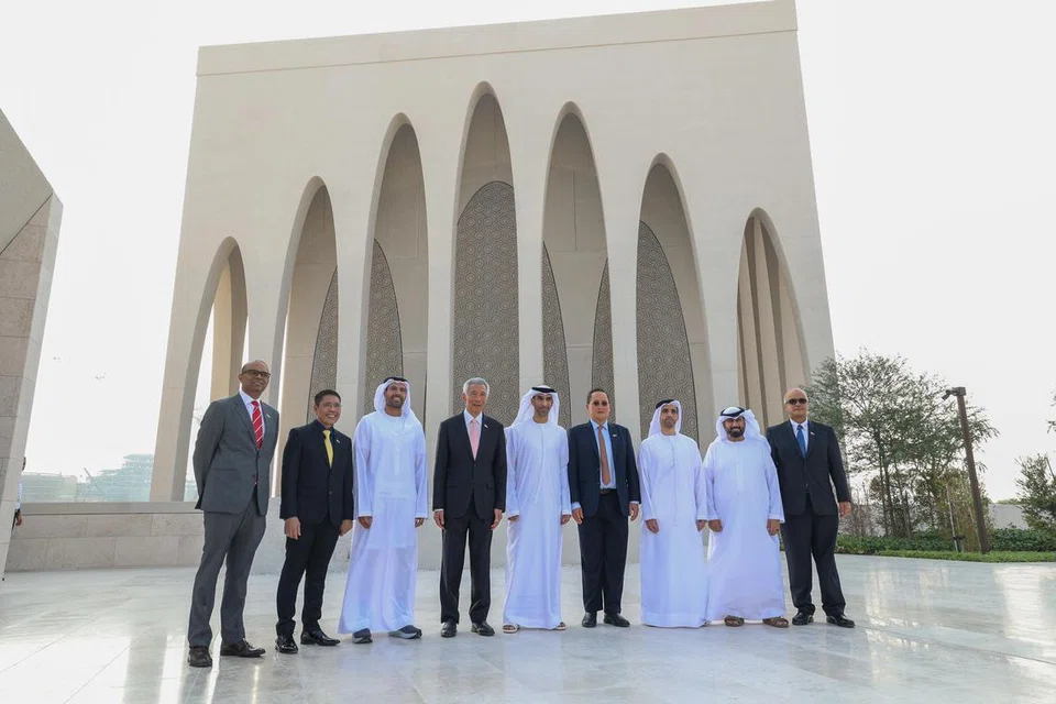 LAMBANG PERPADUAN: Encik Lee (empat dari kiri) bergambar di hadapan masjid yang merupakan sebahagian daripada kompleks antara agama Abrahamic Family House di Abu Dhabi yang melambangkan nilai perpaduan. (Dari kiri) Dr Janil Puthucheary, Dr Maliki Osman, dan Dr Tan See Leng (empat dari kanan).