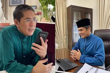 PERERAT SILATURAHIM: Dr Maliki (kiri) menghubungi Menteri Kanan Pendidikan Malaysia, Datuk Dr Radzi Jidin, sempena Hari Raya Aidilfitri. - Foto FACEBOOK / MOHAMAD MALIKI OSMAN