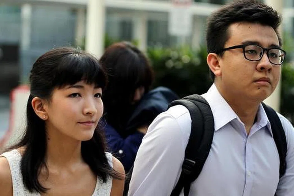 AKUI KESALAHAN: Ai Takagi (dalam gambar bersama Yang Kaiheng) akur dan mengakui - sebagai pemaju, pengendali, editor, moderator, pentadbir dan pengurus laman web The Real Singapore - bahawa kandungan berita yang dimiliki oleh Singapore Press Holdings Ltd (SPH) diterbitkan semula dan sebahagian besarnya diterbitkan semula di laman webnya tanpa kelulusan SPH. - Foto fail THE STRAITS TIMES