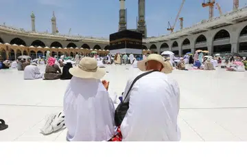 Jemaah haji berkumpul di sekitar Kaabah, di Masjidil Haram di kota suci Makkah pada 30 Jun 2023, semasa musim haji di bawah terik matahari.