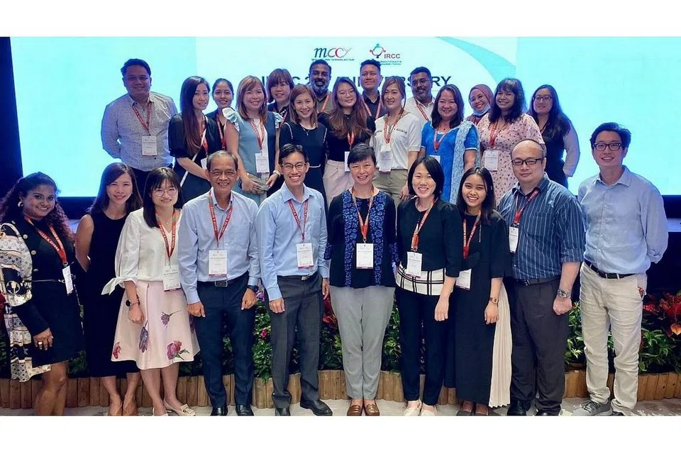 KERJAYA BARU: Encik Adam Haji Hamzah (barisan depan, empat dari kiri) bersama Timbalan Setiausaha (Masyarakat dan Belia), Encik Philip Ong (barisan depan, paling kanan), dan pasukan Kementerian Kebudayaan, Masyarakat dan Belia di acara ulang tahun ke-20 Bulatan Keyakinan Antara Kaum dan Agama. - Foto-foto MCCY, MISI PBB DI HABSYAH DAN ERITREA