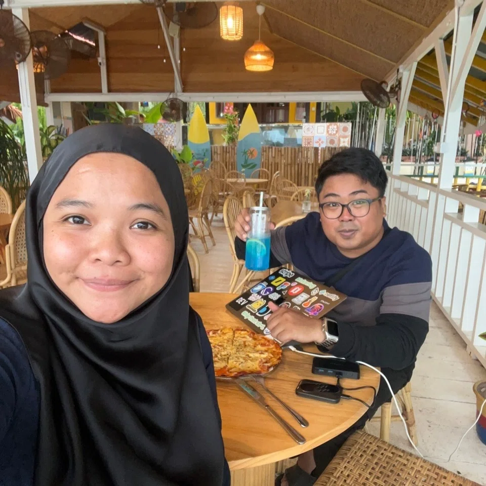 Sejauh ini, Encik Fajar Siddiq (kanan) dan isterinya, Cik Noor Asyikin Muhamad Saer, telah menjejakkan kaki di tujuh tapak perkhemahan di Semenanjung Malaysia - hanya dengan menggunakan kereta Perodua Axia yang diubahsuai dengan menambah khemah di bumbung kereta.