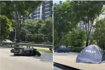 MAUT DI JALAN RAYA: Menurut akhbar Shin Min, terdapat dua khemah biru di tempat kejadian, dan sebuah lori di tepi jalan.