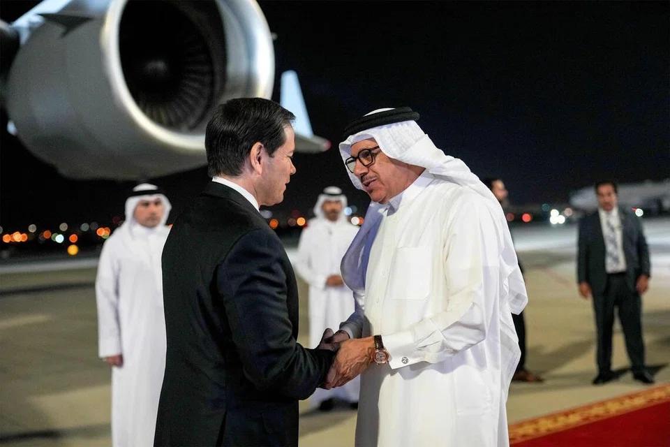 Bahrain's Foreign Minister Abdullatif bin Rashid al-Zayani receives US Secretary of State Marco Rubio upon arrival at Bahrain International Airport near Manama on June 24, 2026, during Rubio's visit to the Middle East to discuss the interim deal between the US and Iran with Arab Gulf allies. Secretary Rubio promised the US' Gulf allies that Washington would protect their interests as it seeks to hammer out a final settlement of the Middle East war in talks with Iran. (Photo by Eric Lee / POOL / AFP)