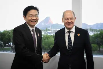 Perdana Menteri, Encik Lawrence Wong (kiri), bersama Canselor Jerman, Encik Olaf Scholz, pada 18 November semasa menghadiri Sidang Puncak Kumpulan 20 (G20) di Brazil.