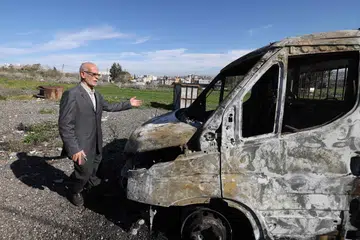 Seorang penduduk Palestin memeriksa kerosakan yang berlaku akibat serangan peneroka Israel yang ganas ke atas perkampungan di Jinsafut, utara Tebing Barat yang diduduki Israel, pada 21 Januari.