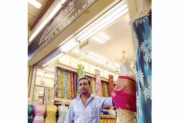 SELESA DI KAMPONG GLAM: Encik Kamal Batcha dan abangnya sudah bertapak di Kampong Glam menjual kain sejak 15 tahun lalu. - Foto PUTRI MARDHIYAH YAZID