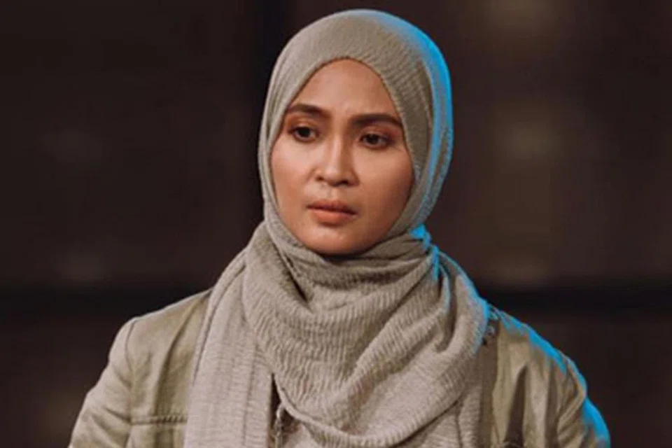 TERKEJUT DAN SEDIH: Siti Nordiana mengakui terpaksa mengambil tindakan untuk membersihkan namanya dan menyerahkan keputusan kepada pihak berkuasa. - Foto fail