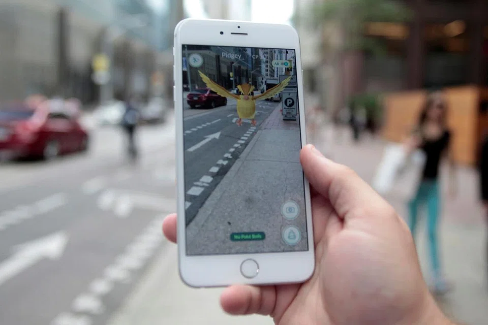 Aplikasi permainan Pokemon GO. - Foto REUTERS