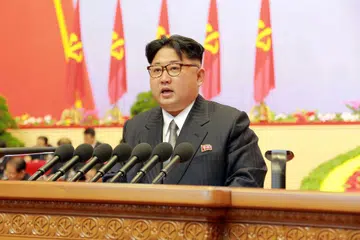 DISAHKAN SEBAGAI PEMIMPIN: Encik Kim mengumumkan dasar membangunkan senjata nuklear dan ekonomi sewaktu kongres pertama parti pemerintah Korea Utara Jumaat lalu. - Foto AFP